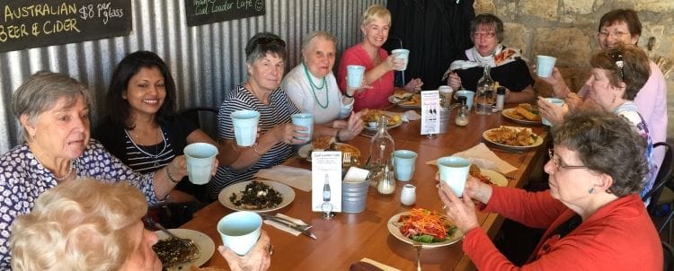 Group of women having a drink in a coffee shop